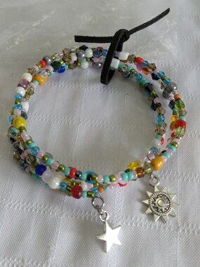 B- Handmade memory wire bracelets set with beads and pendants